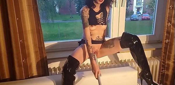  Horny whore fucks herself with the baseball bat at the window for the neighbors